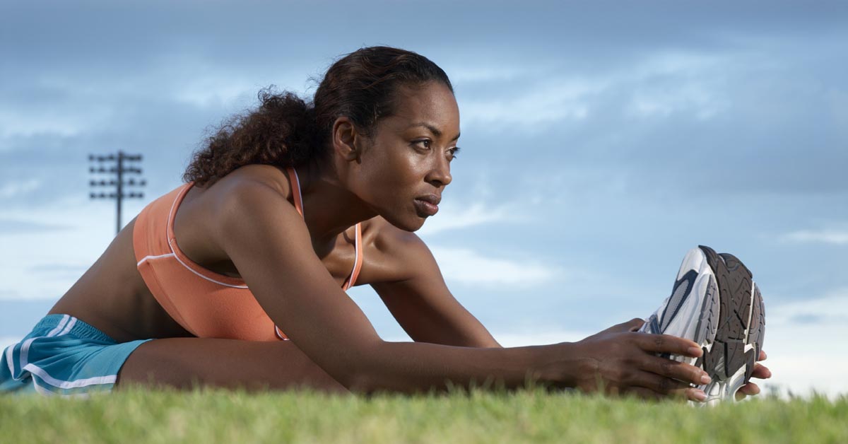 woman stretching her leg